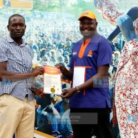 ODM Secretary General Edwin Sifuna presents a life membership certificate to Samuel Opinde