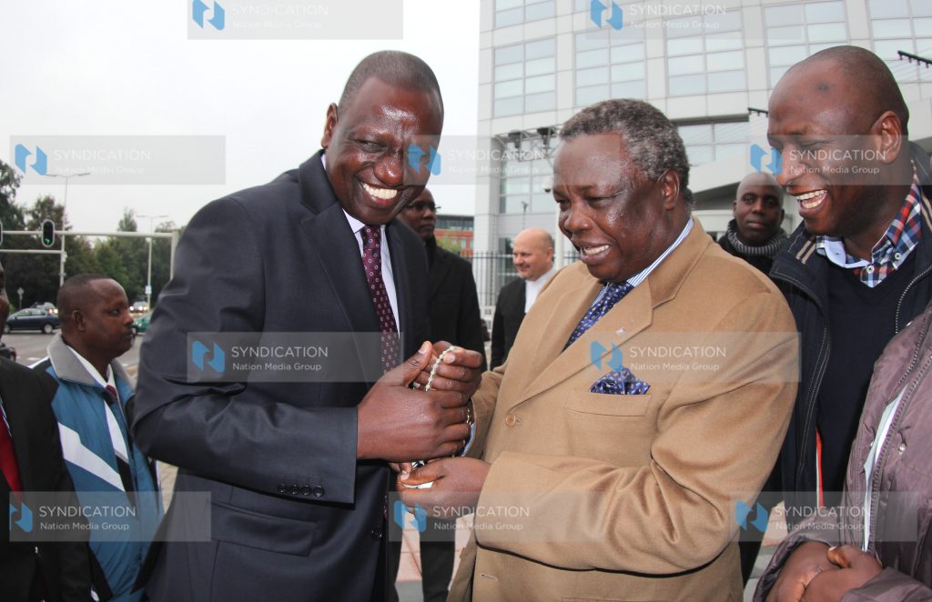 Deputy President William Ruto and COTU secretary general Francis Atwoli outside ICC