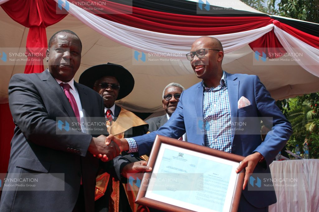 Education CS Fred Matiang'i, AMREF Group Chief Executive Officer Dr Githinji Gitahi