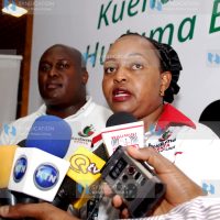 Devolution and Planning Cabinet Secretary Anne Waiguru, flanked by Dennis Mutuku, the head of the Huduma Kenya secretariat