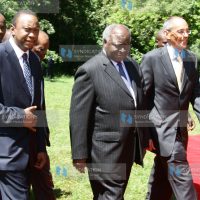 President Mwai Kibaki walks with ICEA Lion Group chairman James Ndegwa and Finance Minister Uhuru Kenyatta