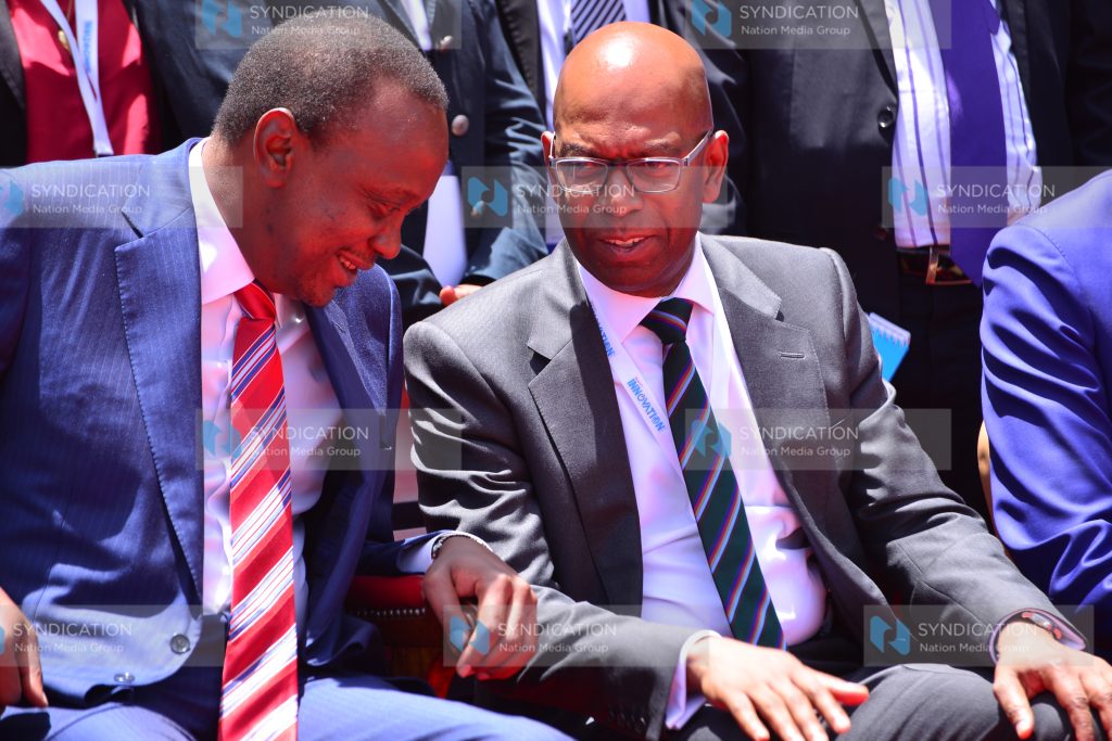 President Uhuru Kenyatta left with Safaricom Limited CEO Bob Collymore
