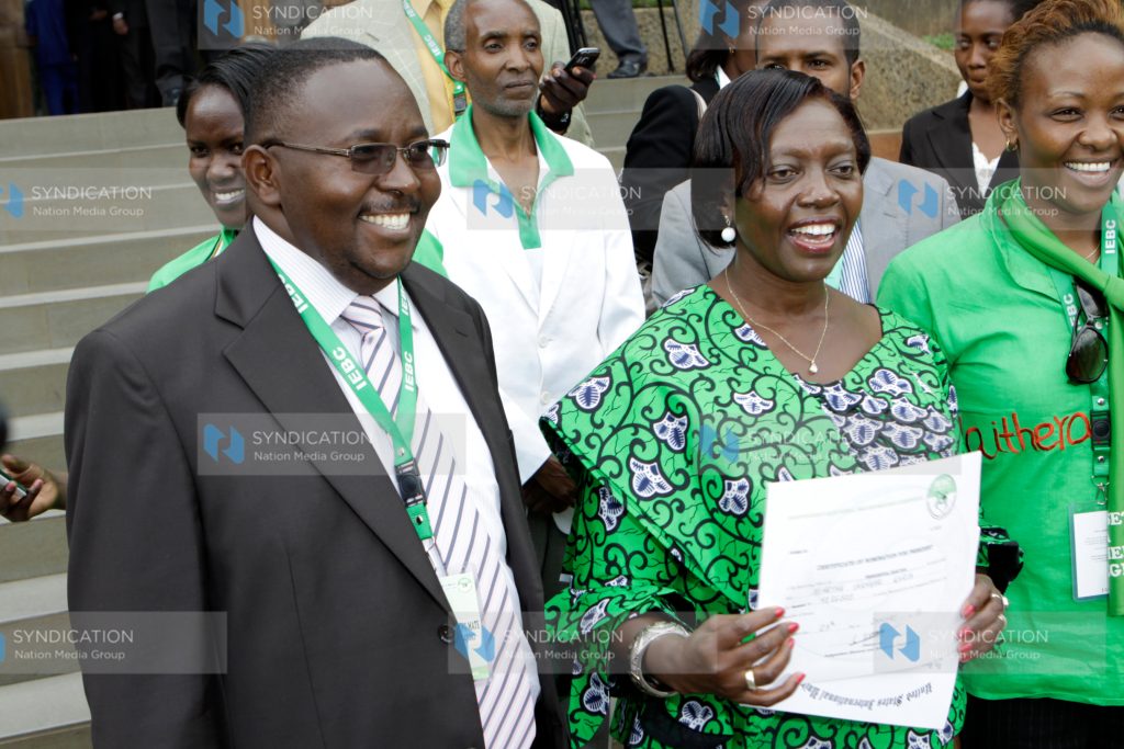Narc-Kenya Martha Karua shows off her certificate after presenting her nomination papers to the IEBC