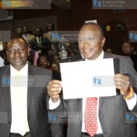 Uhuru Kenyatta shows off his certificate with his running mate William Ruto