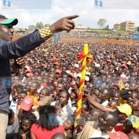 Jubilee Coalition presidential candidate Uhuru Kenyatta’s his running mate William Ruto addresses a rally