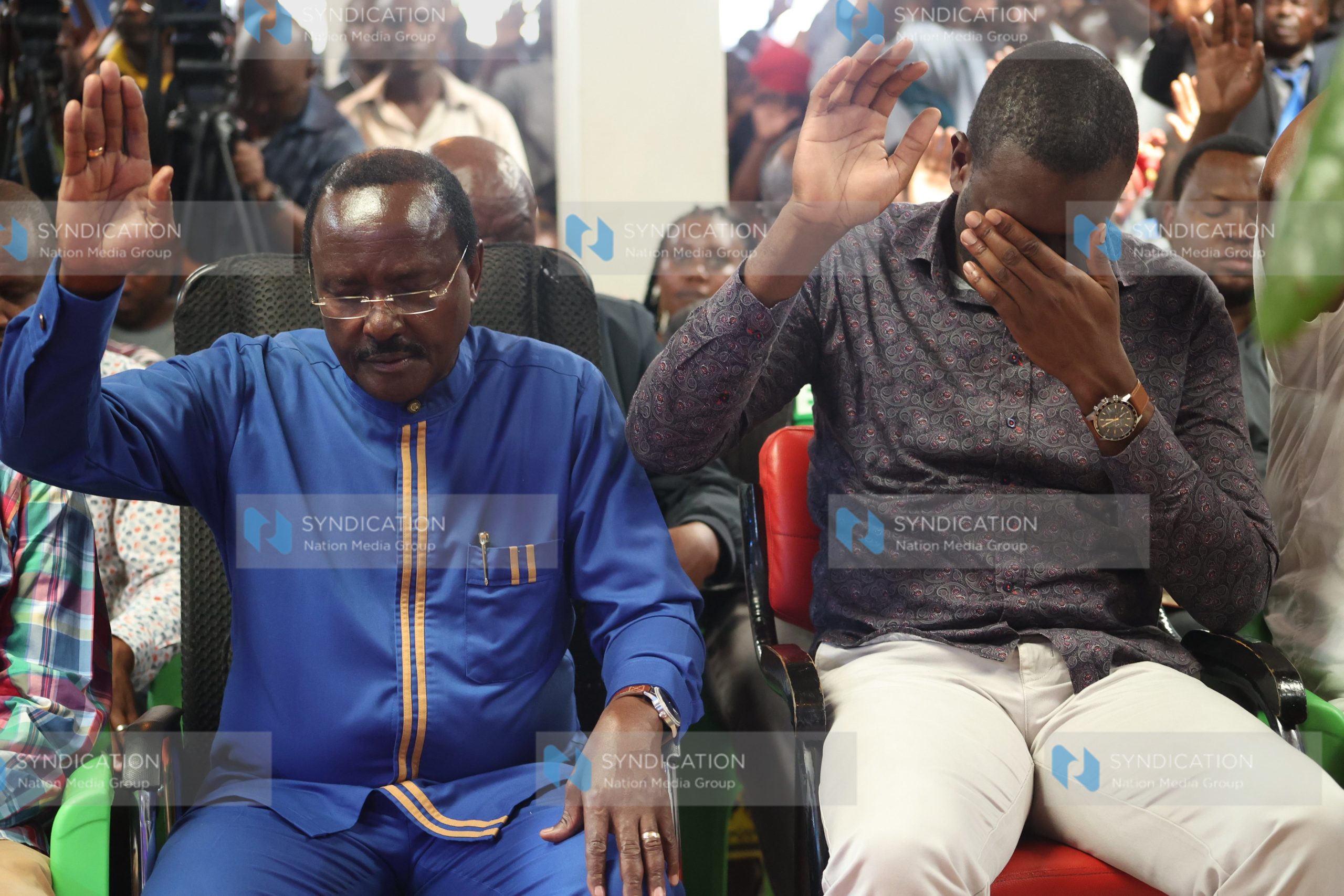 ODM Secretary General Edwin Sifuna raising their hands for prayers