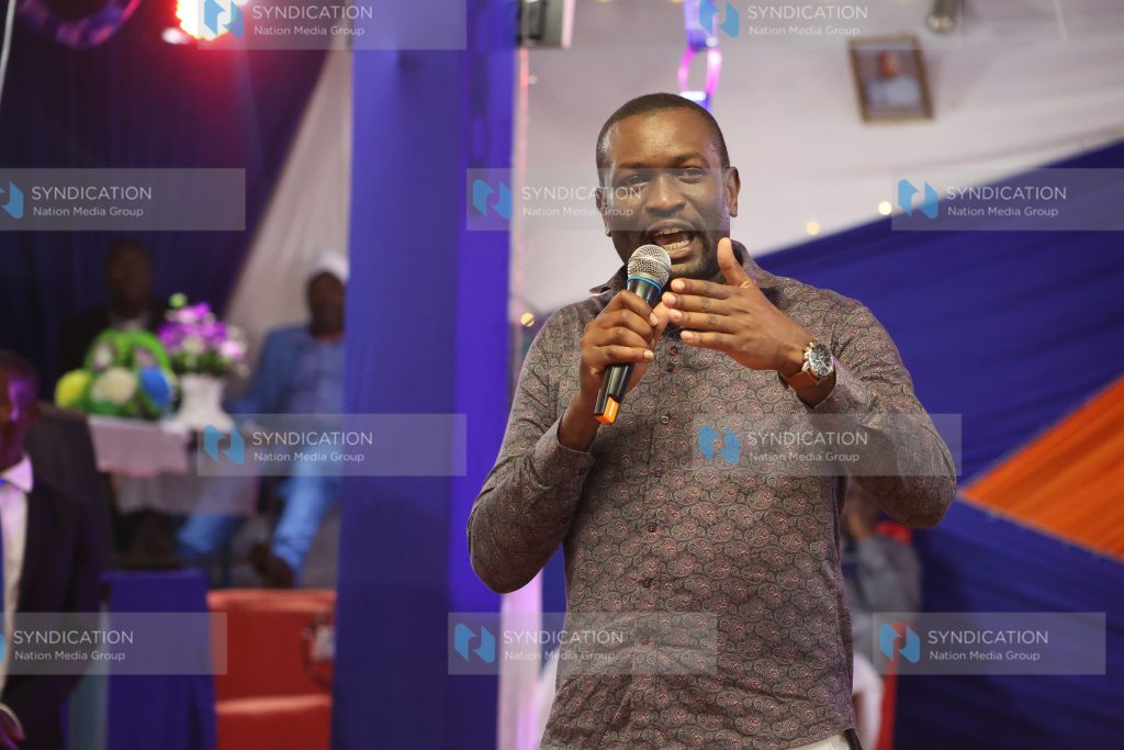 Edwin Sifuna speaking while attending a church service