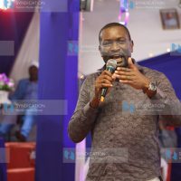 Edwin Sifuna speaking while attending a church service