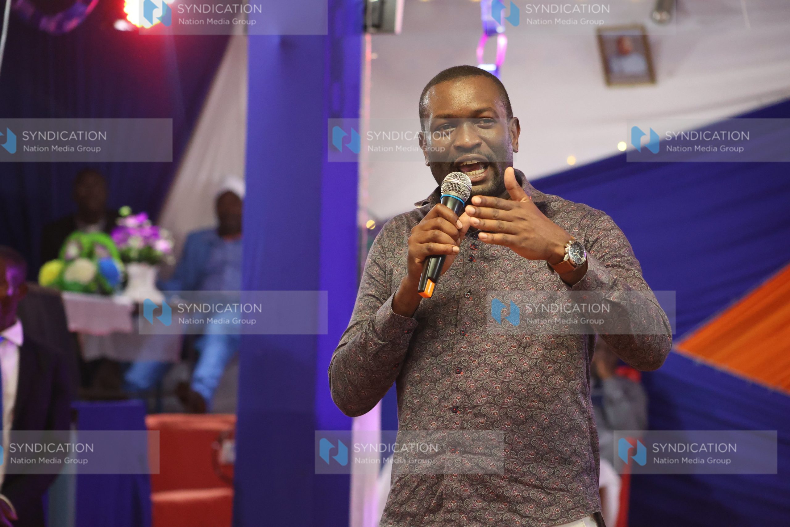 Edwin Sifuna speaking while attending a church service