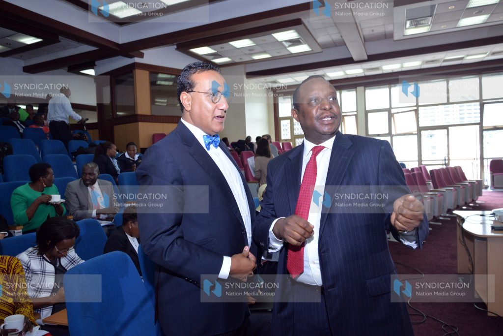 National Treasury Cabinet Secretary Henry Rotich (right)