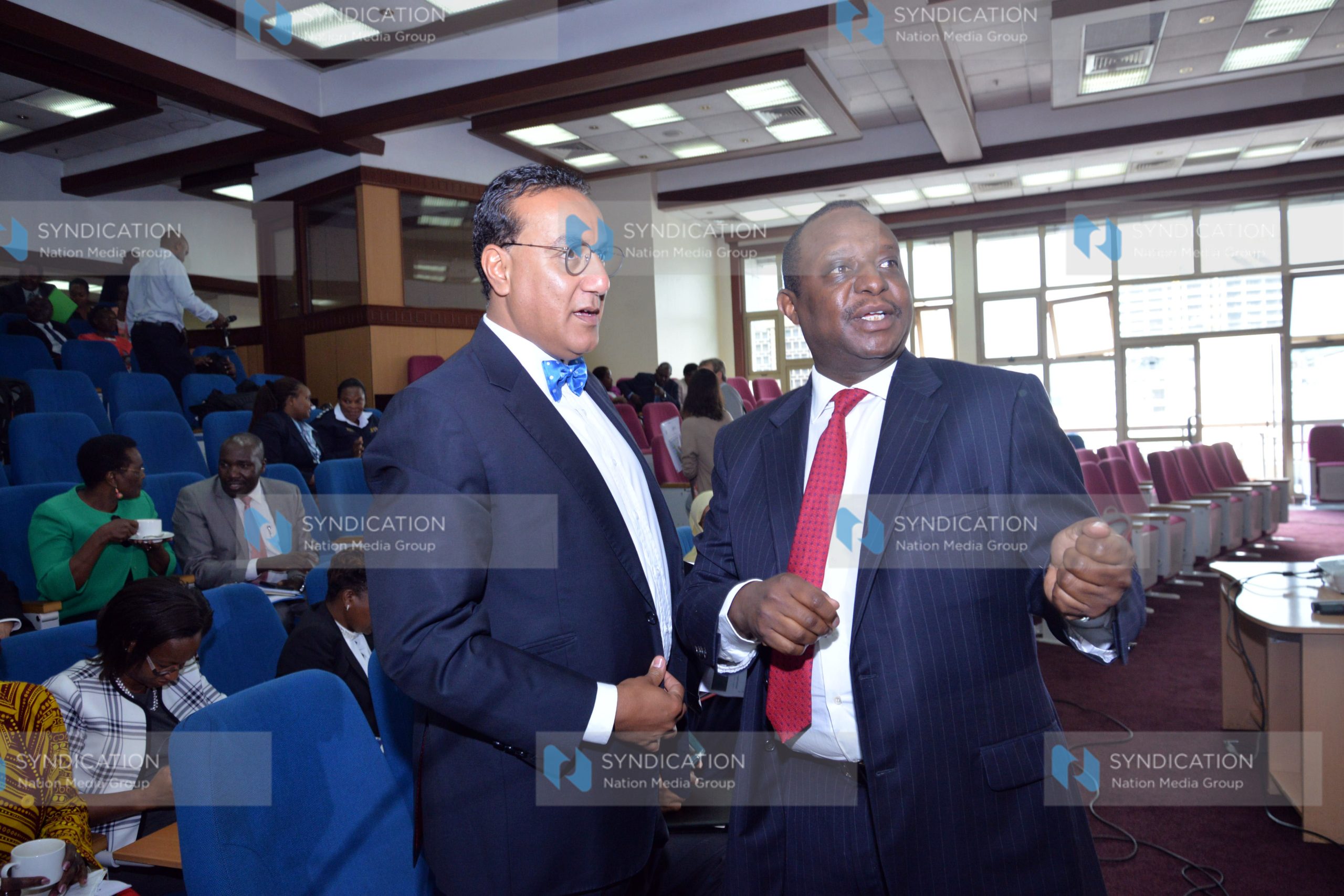 National Treasury Cabinet Secretary Henry Rotich (right)