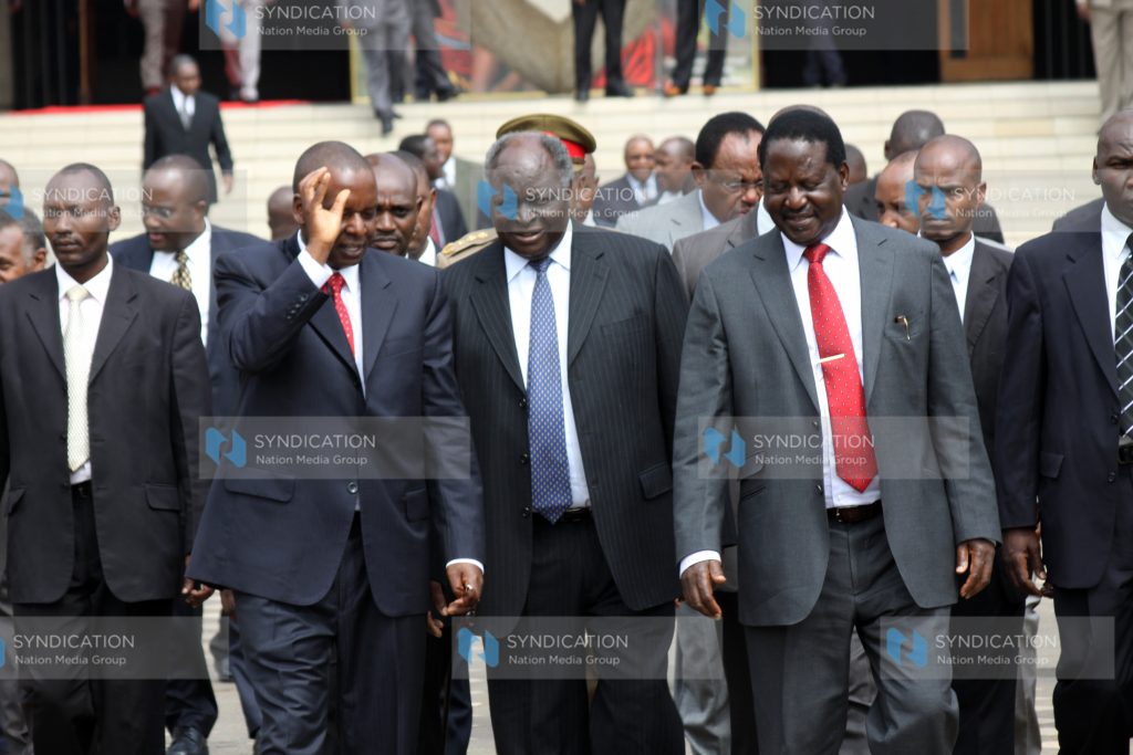 President Mwai Kibaki (center) with Prime Minister Raila Odinga