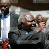 Former President Mwai Kibaki gestures at the University of Nairobi