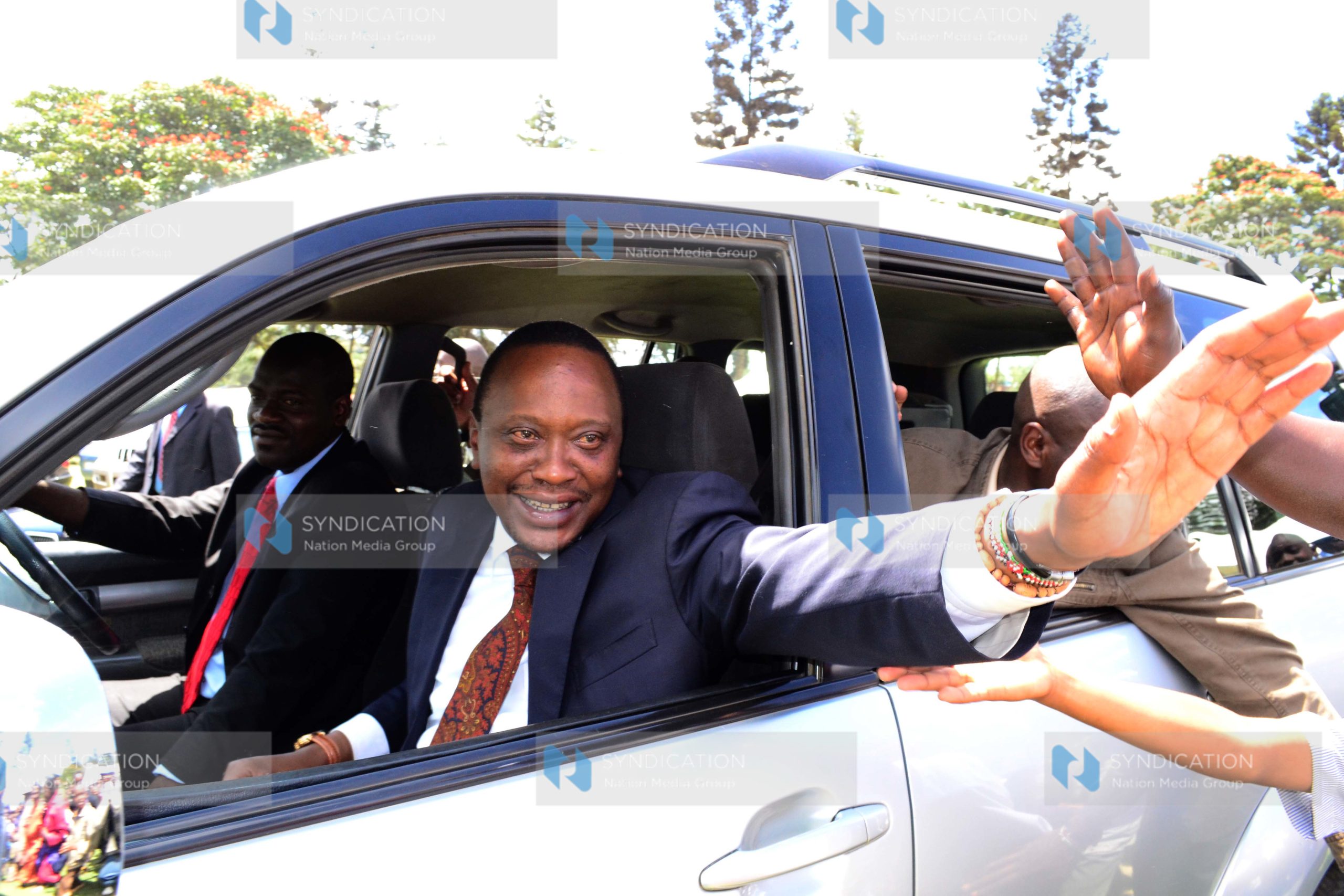 Deputy Prime minister Uhuru Kenyatta waves to the crowd