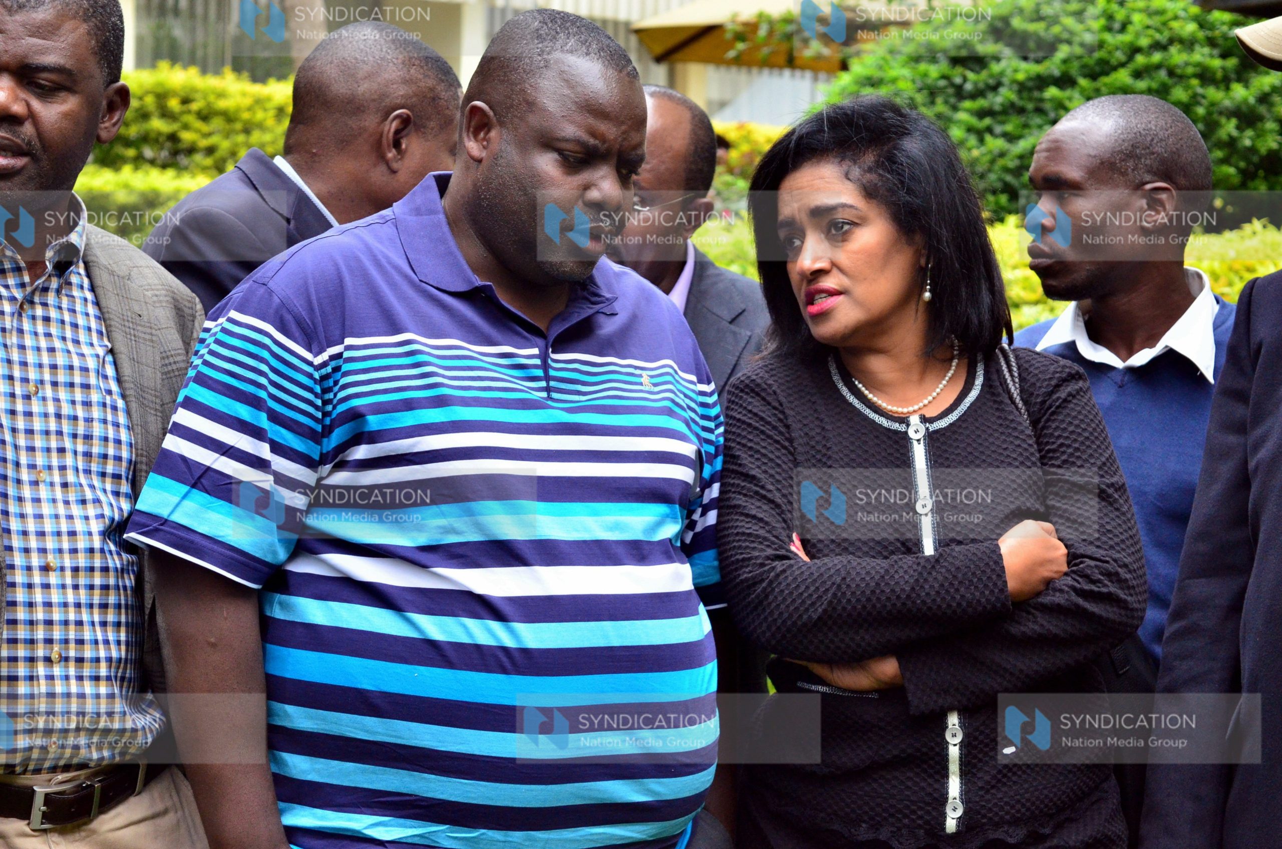 George Aladwa (left) confers with Nairobi County Women Rep Esther Passaris