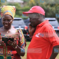 Martha Karua chats with her running mate Joseph Gitari(right)