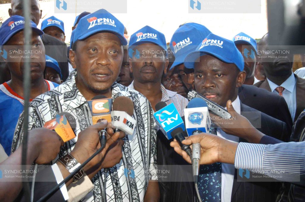 Deputy Prime minister Uhuru Kenyatta(left) addresses the media
