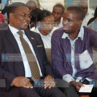 Kenneth Marende (left) attends the burial of his late mother, Ms. Dorcas Chek Gumbo