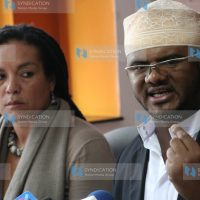 Hassan Omar (righ) flanked by KHRC executive director Muthoni Wanyeki address a press conference