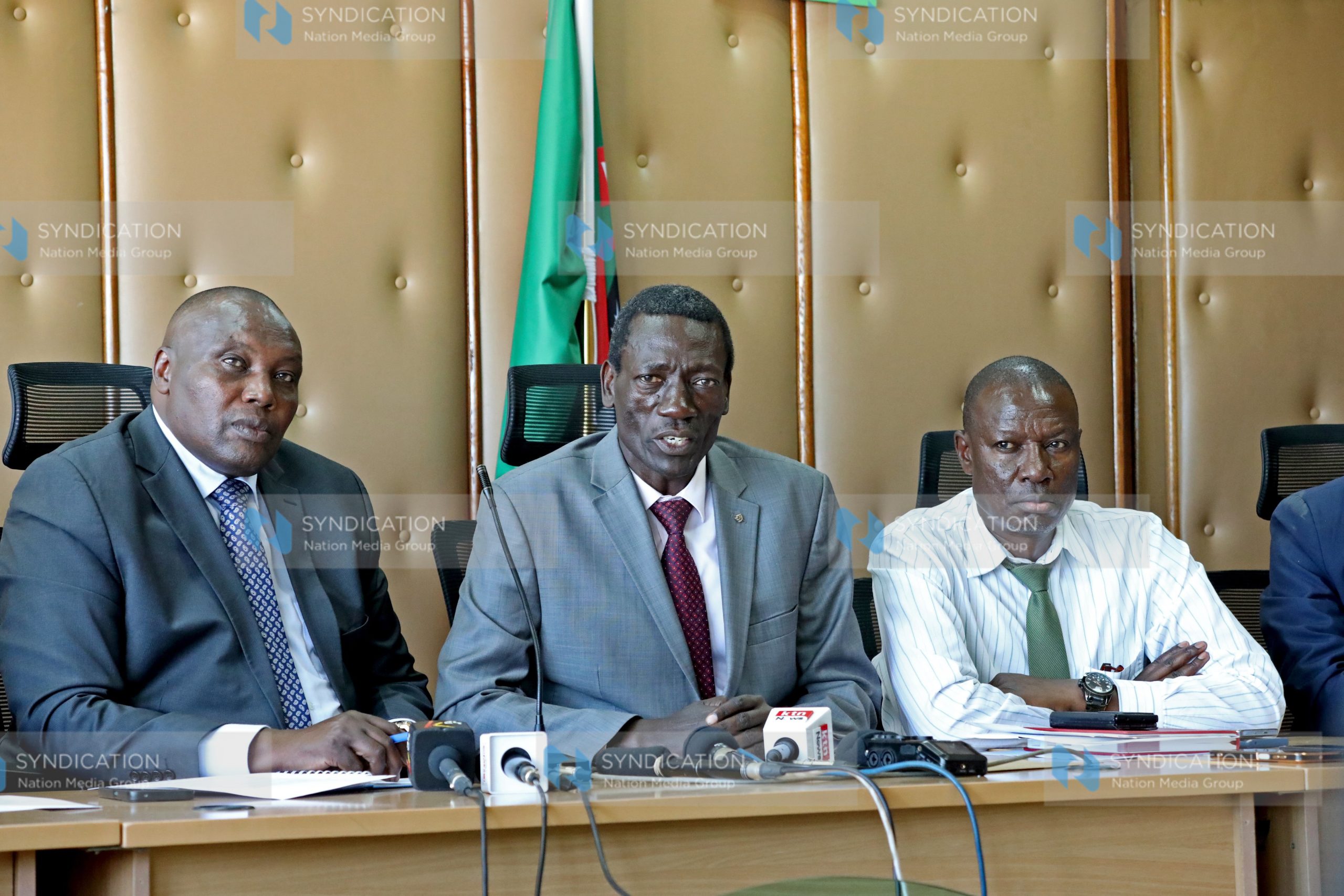 (KNUT) Secretary General Collins Oyuu (center)