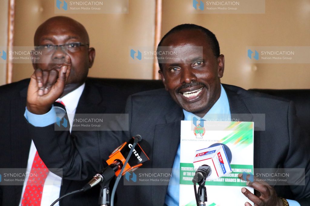 Wycliffe Omucheyi (left) Secretary General Wilson Sossion addressing the media