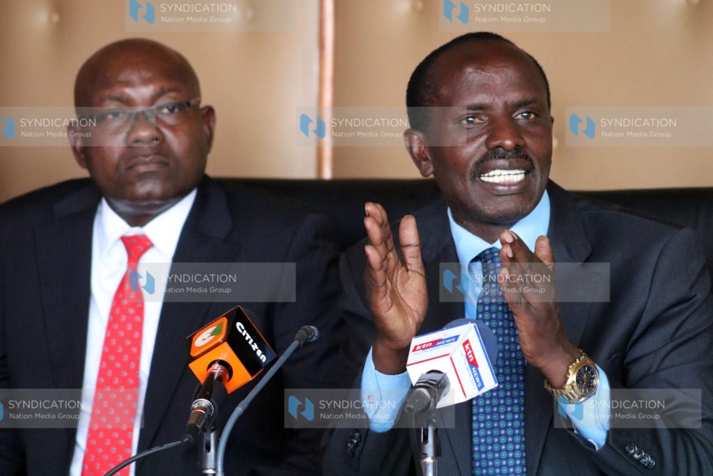 Wycliffe Omucheyi (left) Secretary General Wilson Sossion addressing the media