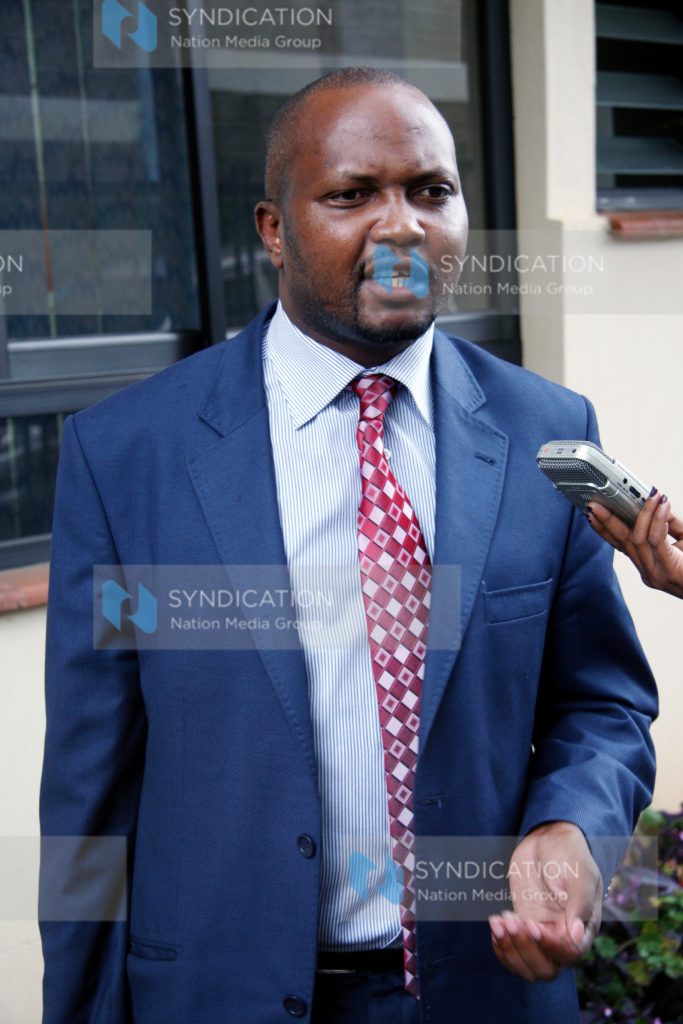 PNU activist Moses Kuria speaks to journalists
