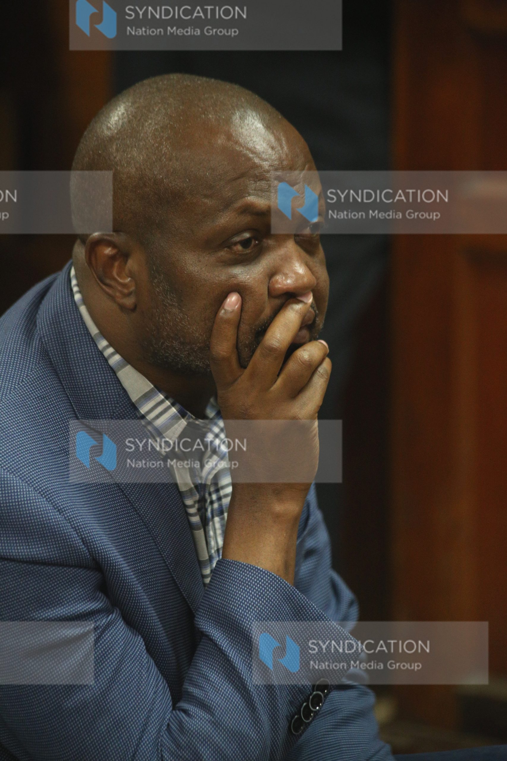 Moses Kuria in a pensive mood at Milimani Law Courts