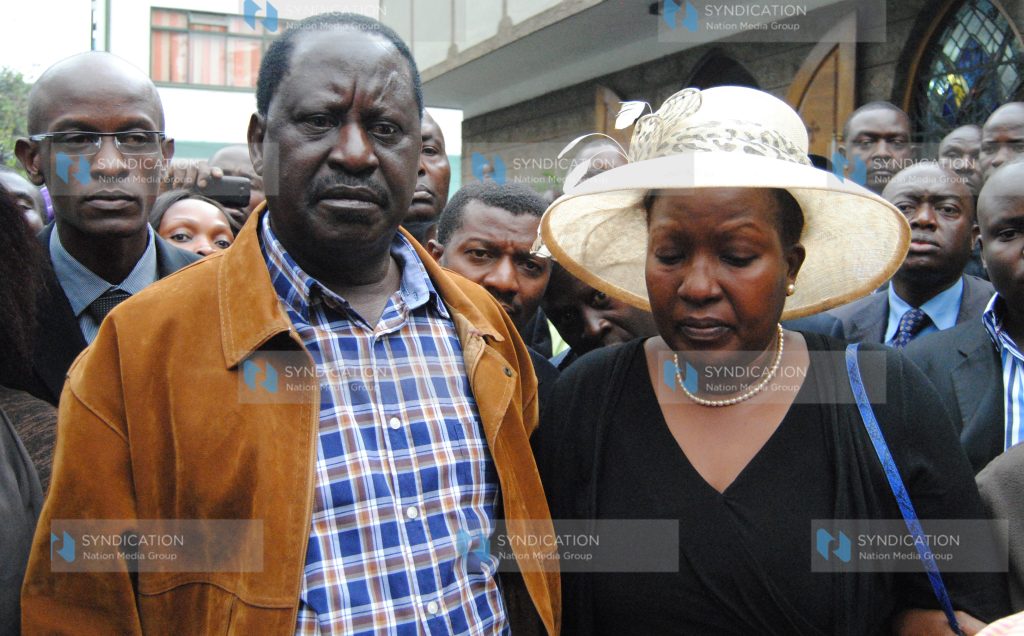 Former Prime Minister Raila Odinga with Rose Kajwang’, wife of the late Homa Bay Senator Otieno Kajwang’
