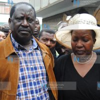 Former Prime Minister Raila Odinga with Rose Kajwang’, wife of the late Homa Bay Senator Otieno Kajwang’
