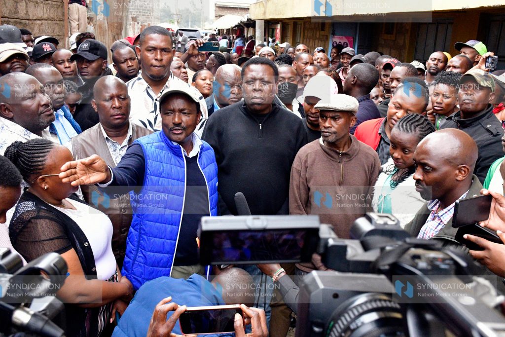 Wiper Party Leader Kalonzo Musyoka (left) briefs media