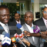 Raphael Tuju (Left) speaking to the press