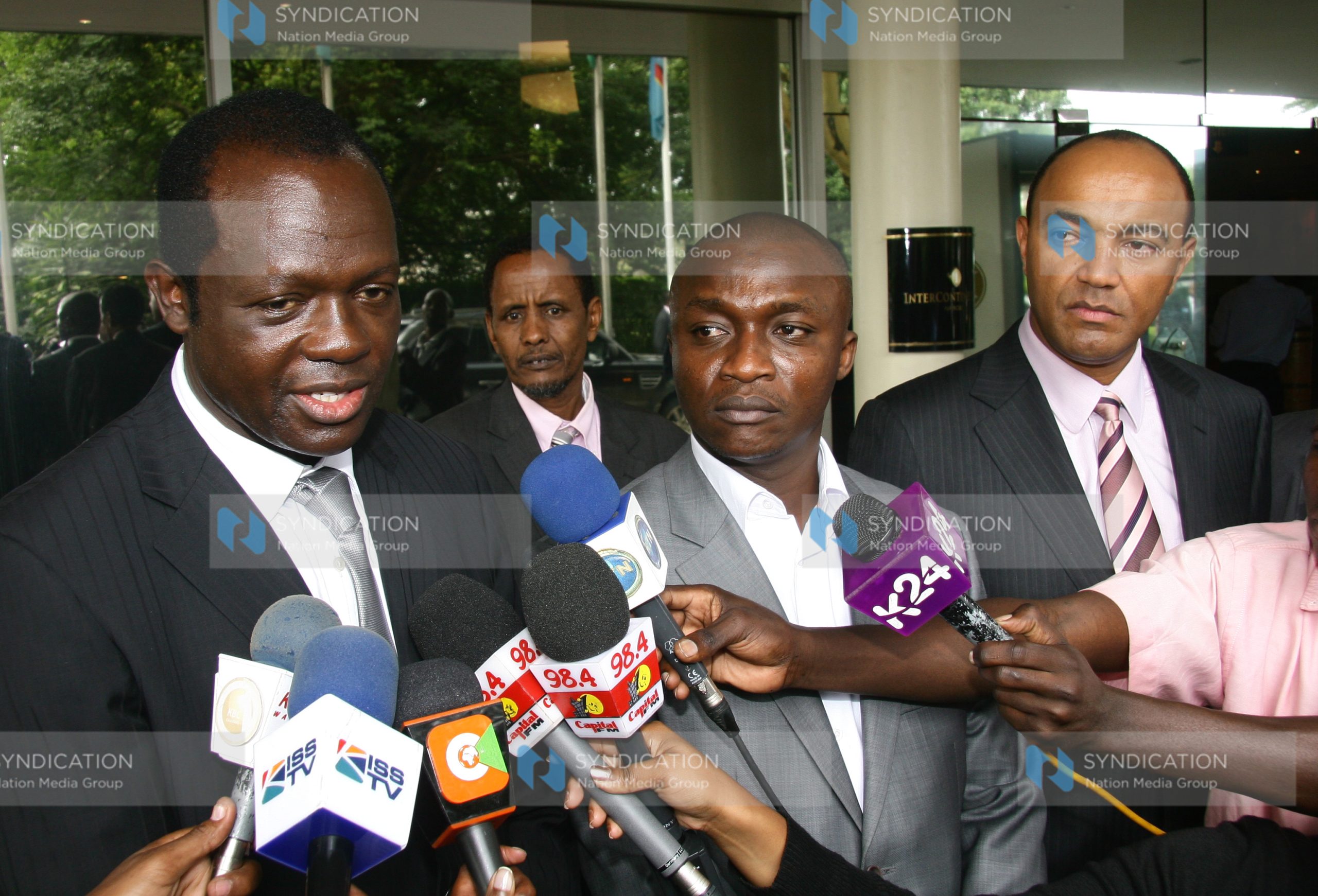 Raphael Tuju (Left) speaking to the press