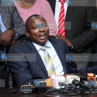 Kimani Ichung’wah addressing the media at parliament buildings