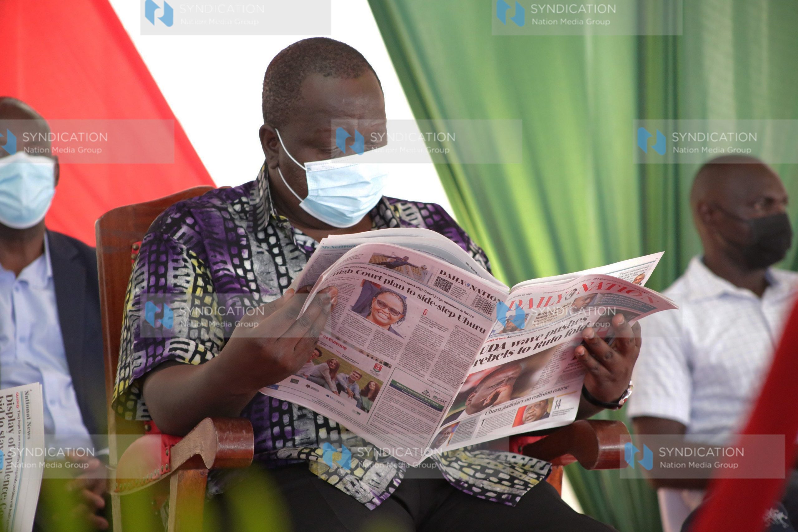 Interior CS Fred Matiang’i reads a copy of the Daily Nation