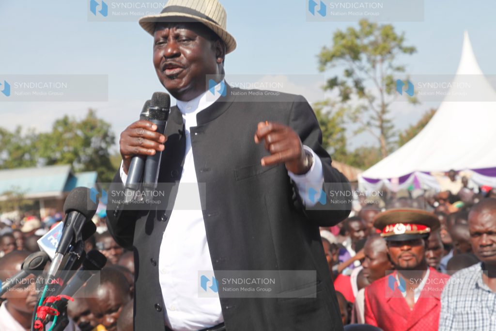 Raila Odinga addresses mourners during the burial