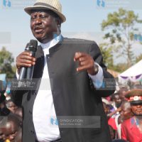 Raila Odinga addresses mourners during the burial