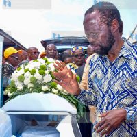 Anyang’ Nyong’o pays his respects beside the casket of the late Dr. Phoebe Asiyo