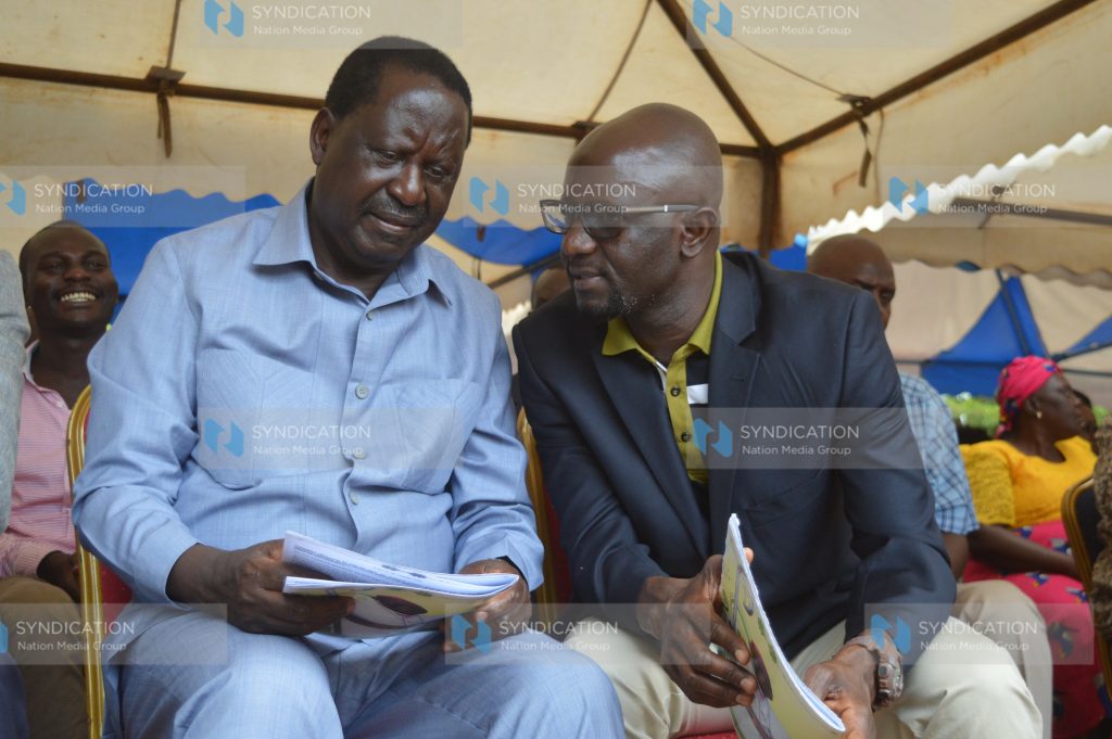 Raila Odinga (left) and Alego-Usonga MP Samule Atandi