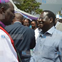 Raila Odinga (right) and Anglican Archbishop Jackson Ole Sapit
