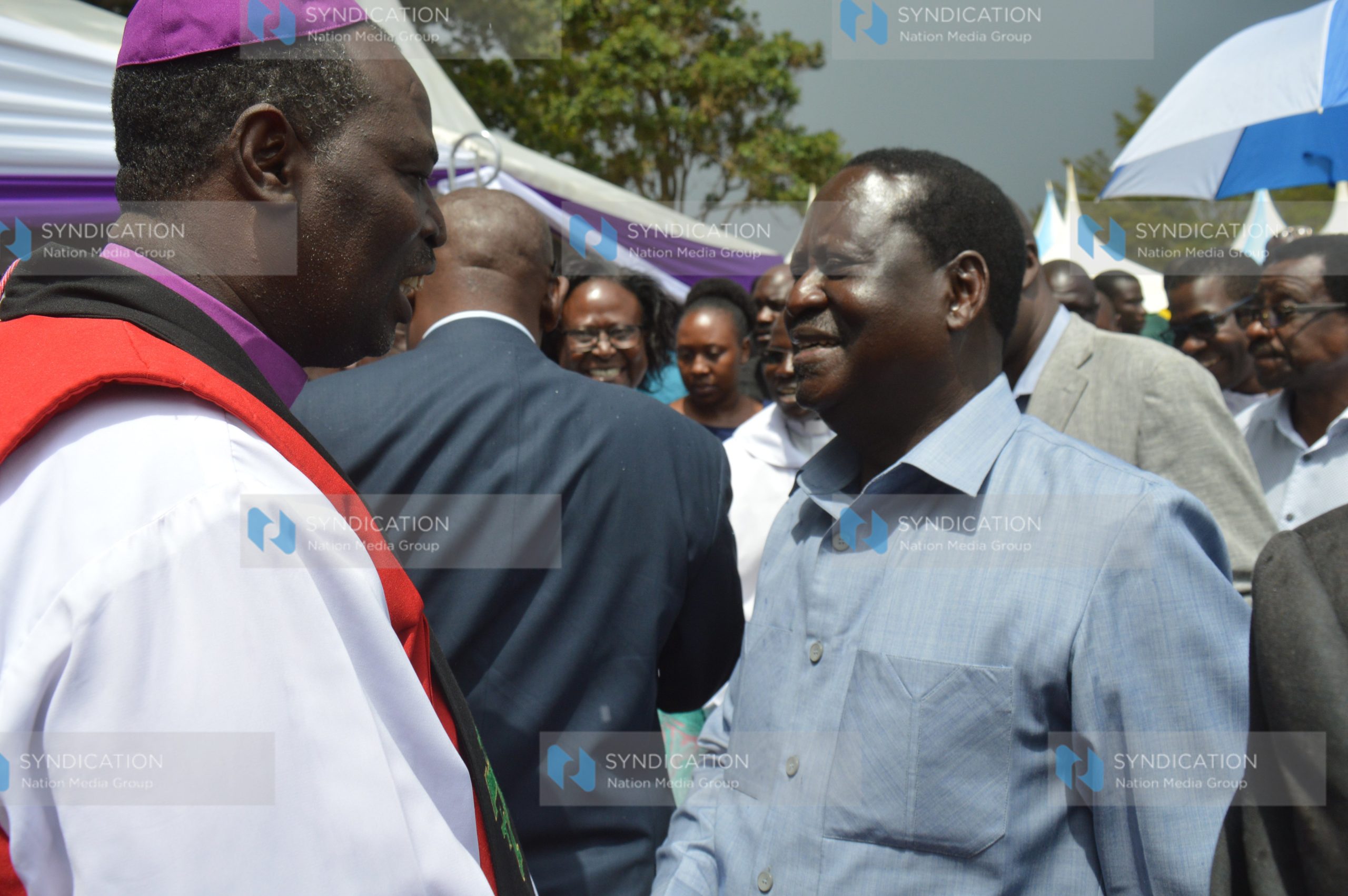 Raila Odinga (right) and Anglican Archbishop Jackson Ole Sapit