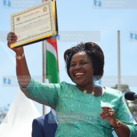 Joyce Laboso holds up her inauguration certificate