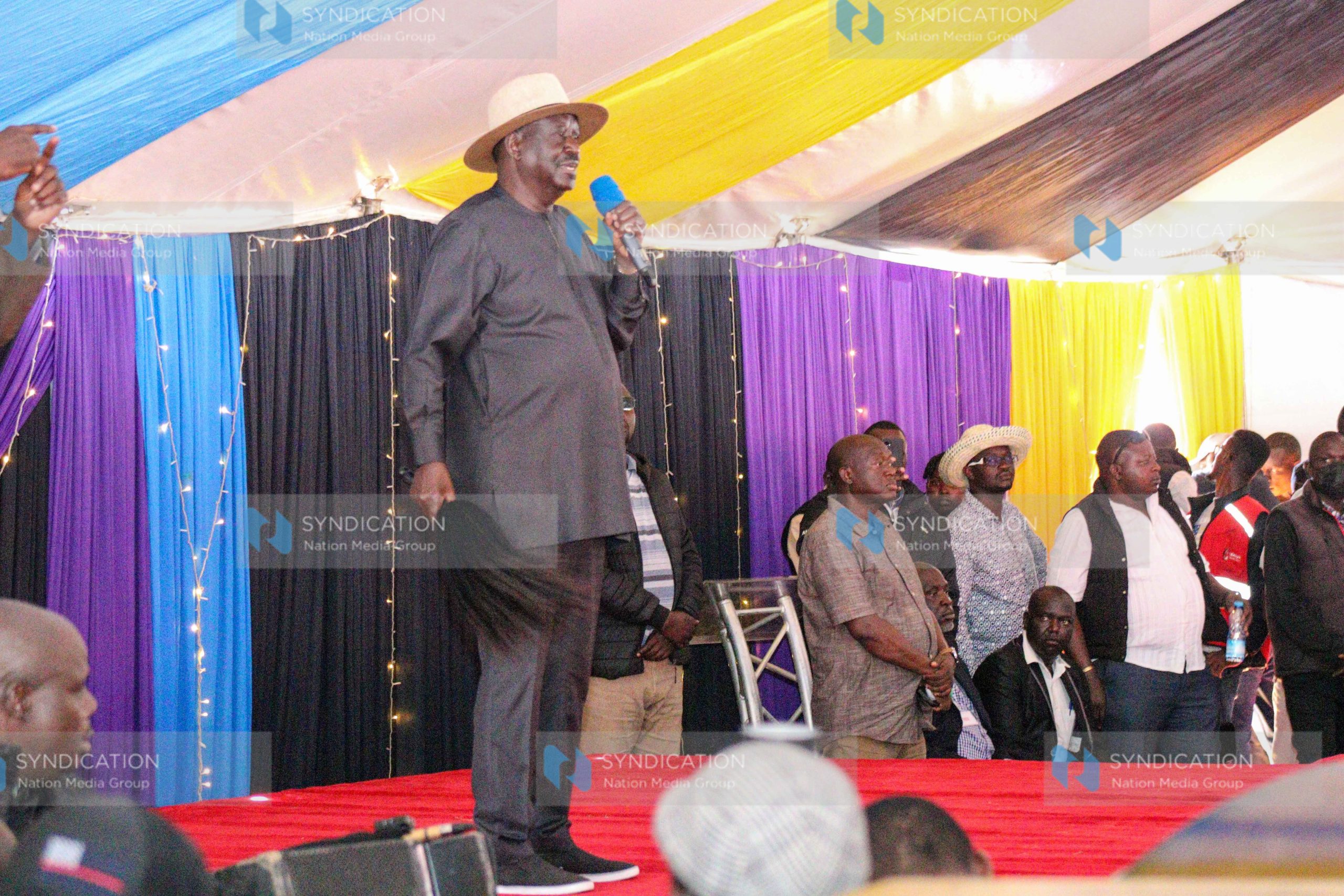 Raila Odinga speaking to mourners during the funeral service