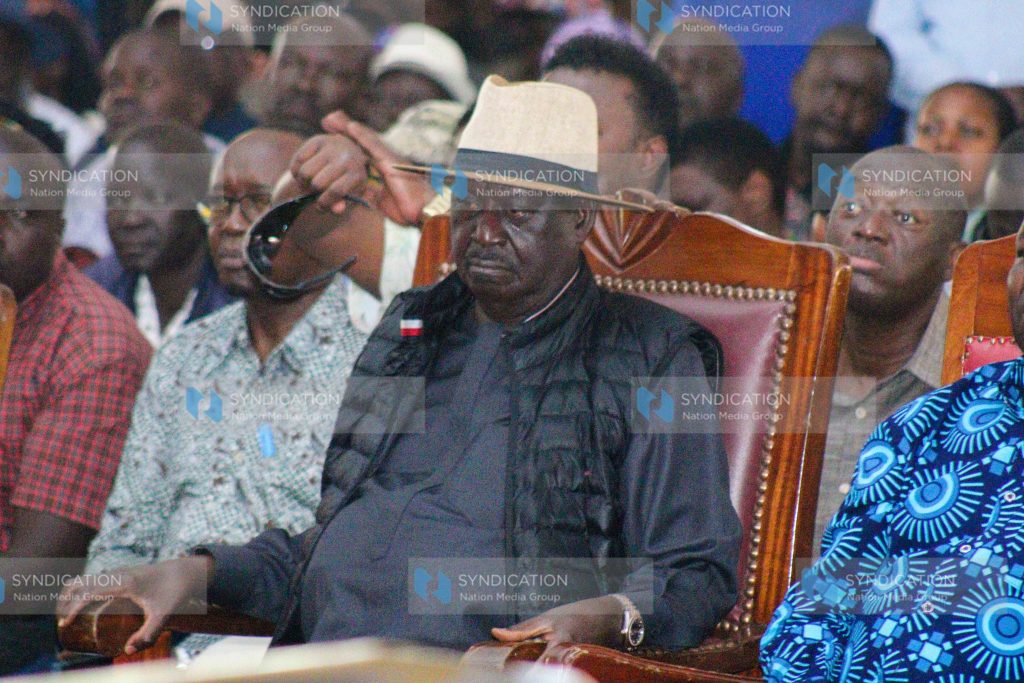 Opposition leader Raila Odinga attends the funeral service