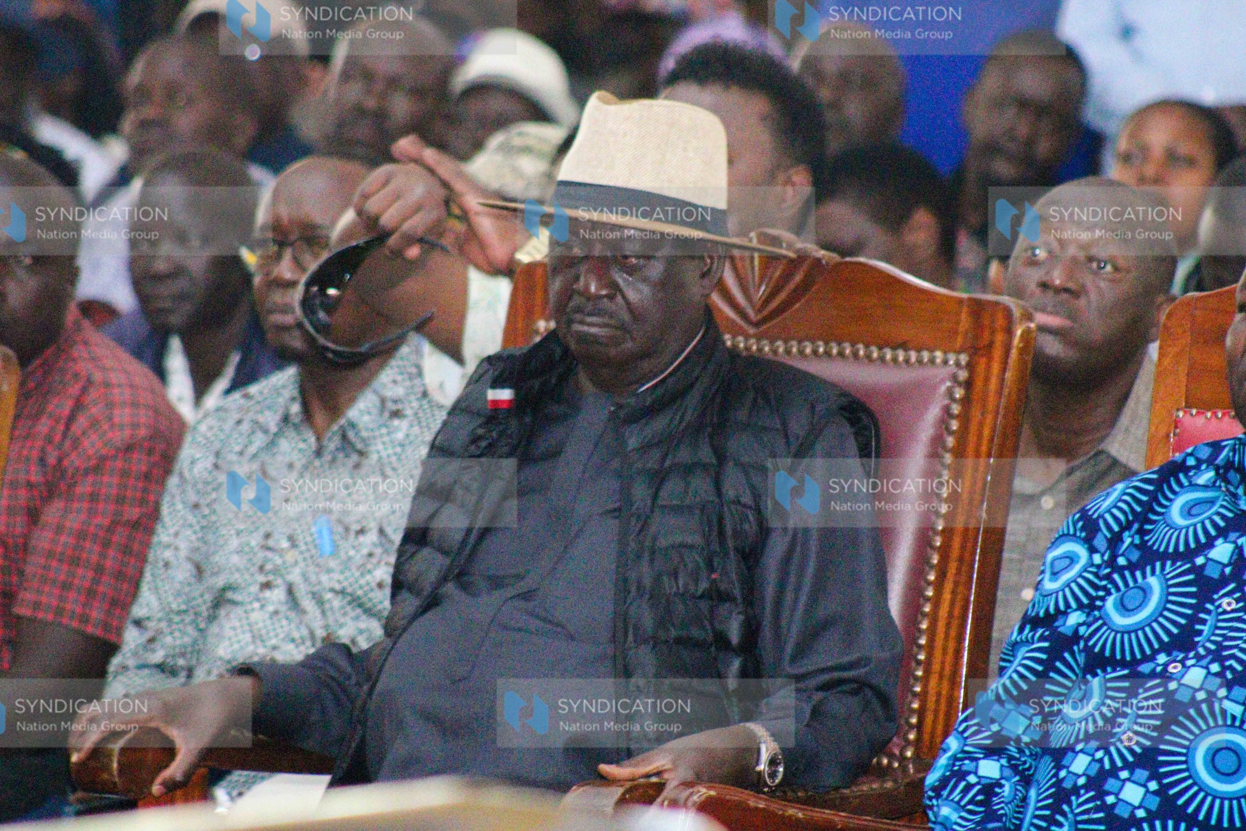 Opposition leader Raila Odinga attends the funeral service
