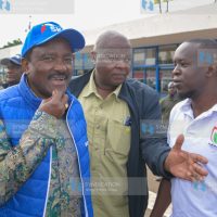 Kalonzo Musyoka (left) shortly after landing at Kisumu International Airport
