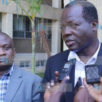 Cabinet Secretary without portfolio Raphael Tuju (right)