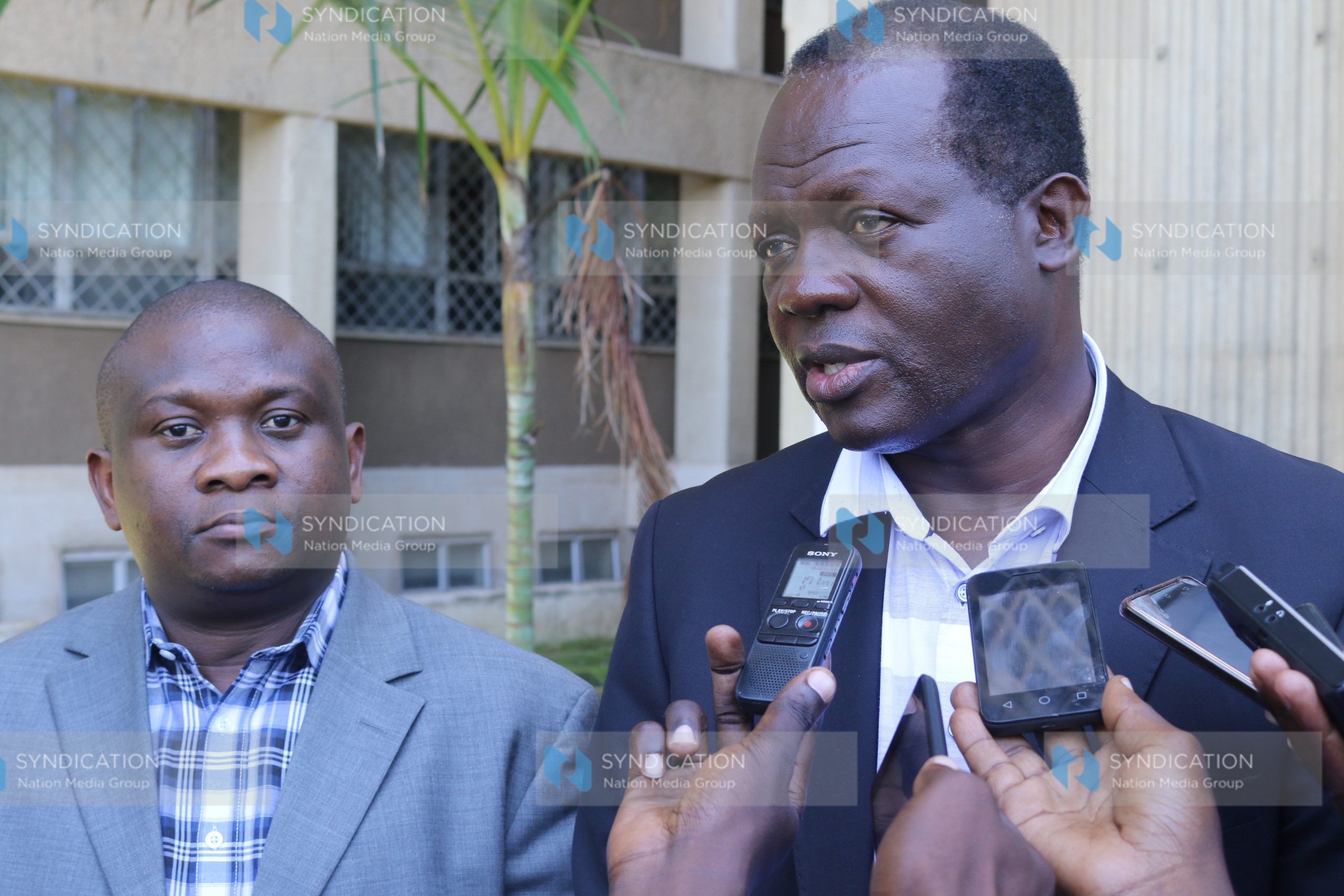 Cabinet Secretary without portfolio Raphael Tuju (right)