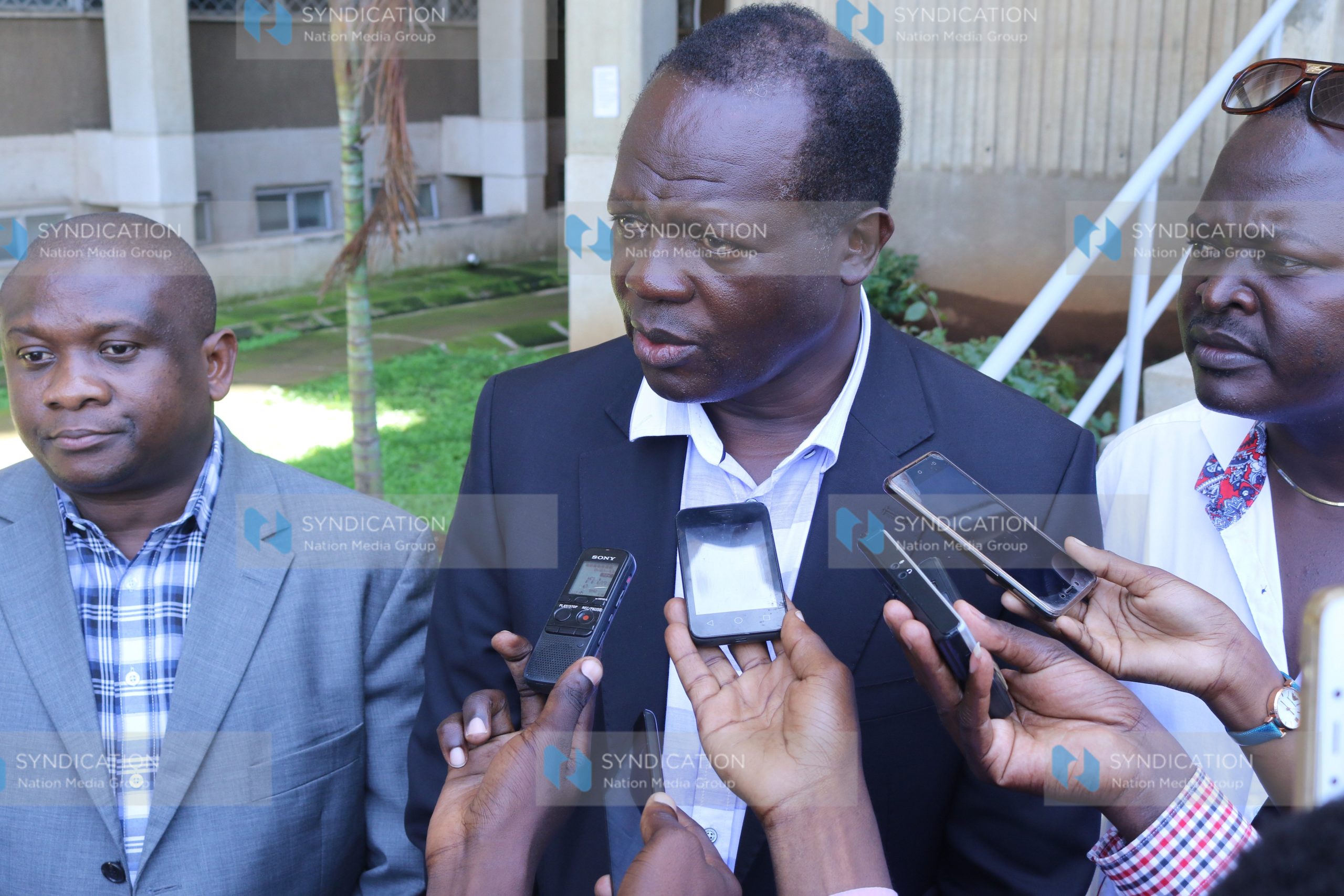 Cabinet Secretary without portfolio Raphael Tuju (right)