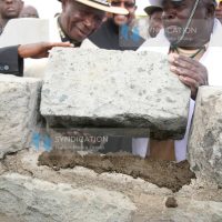 Former Vice President Moody Awori (left) joins in laying of the foundation stone
